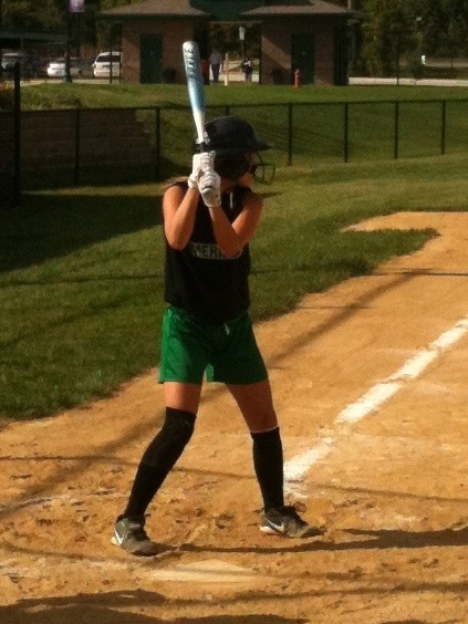girl playing softball